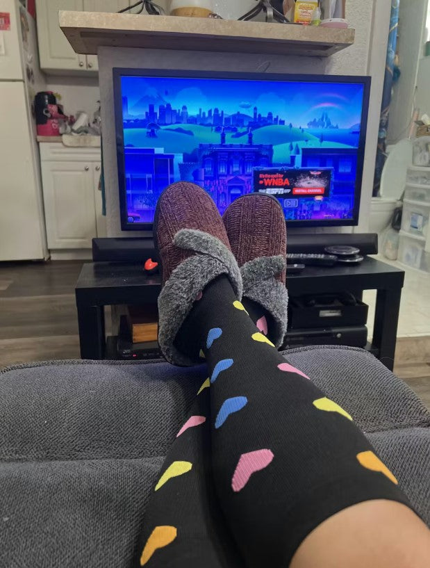 SqueezeGear compression socks worn for joint pain and swelling support, easy to put on with soft stretchy fabric during recovery